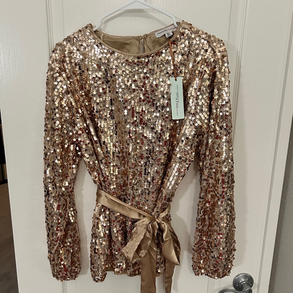 NWT. Yuni Sequined  gold blouse with satin tie. Dressy  or with jeans.
